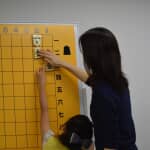 Instructors should change activities from a match to others such as Tsume Shogi (Shogi puzzles) when girls hate to engage in a match.